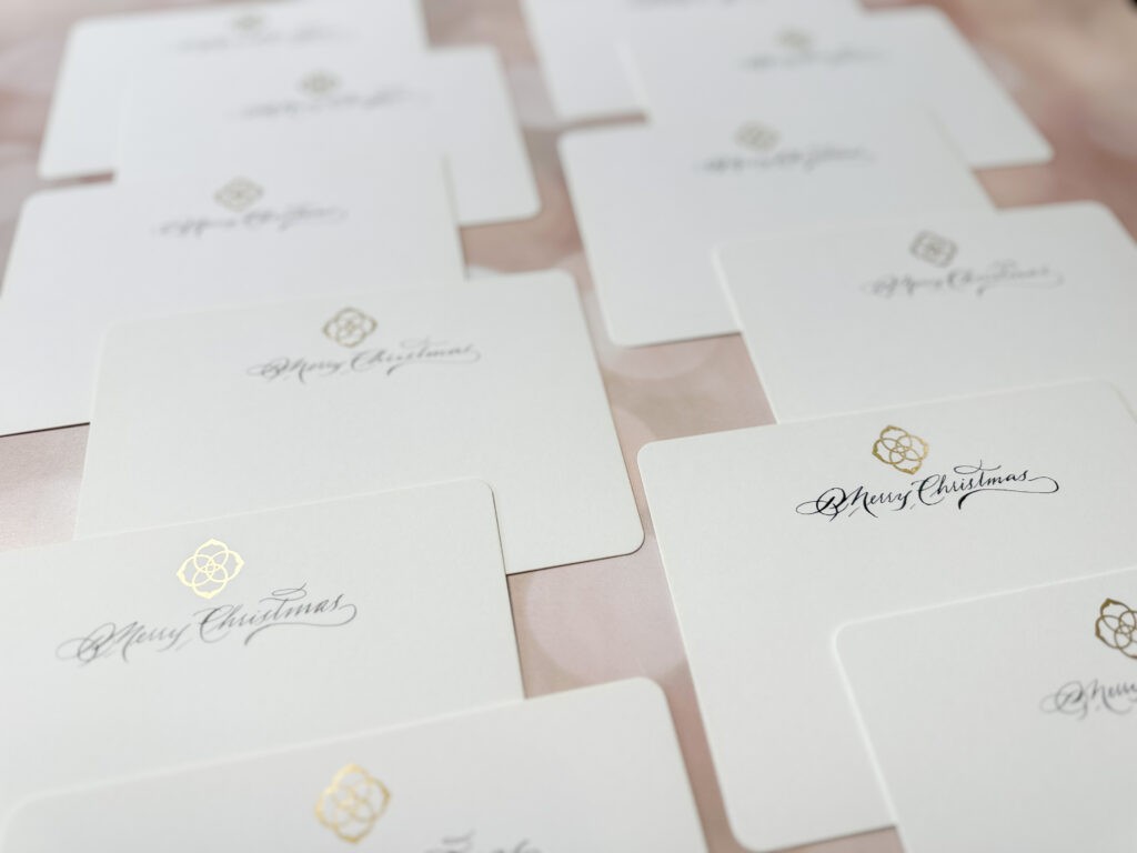 Pointed pen calligraphy on branded Kendra Scott stationery.