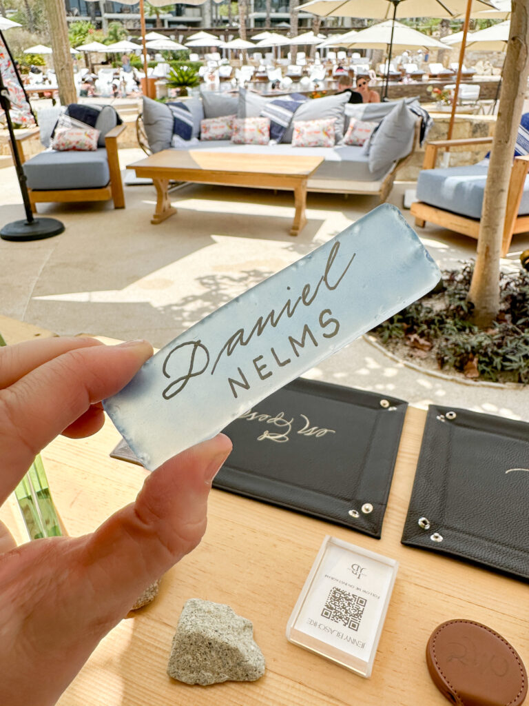 Place card calligraphy performed on-site during corporate event.